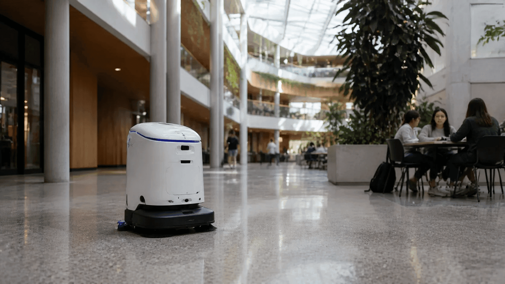 Commercial cleaner operating in a large Australian workplace atrium